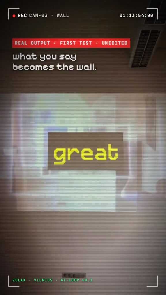 A projected wall in a dim room showing the word great in large yellow pixel type, labelled real output, first test, unedited.